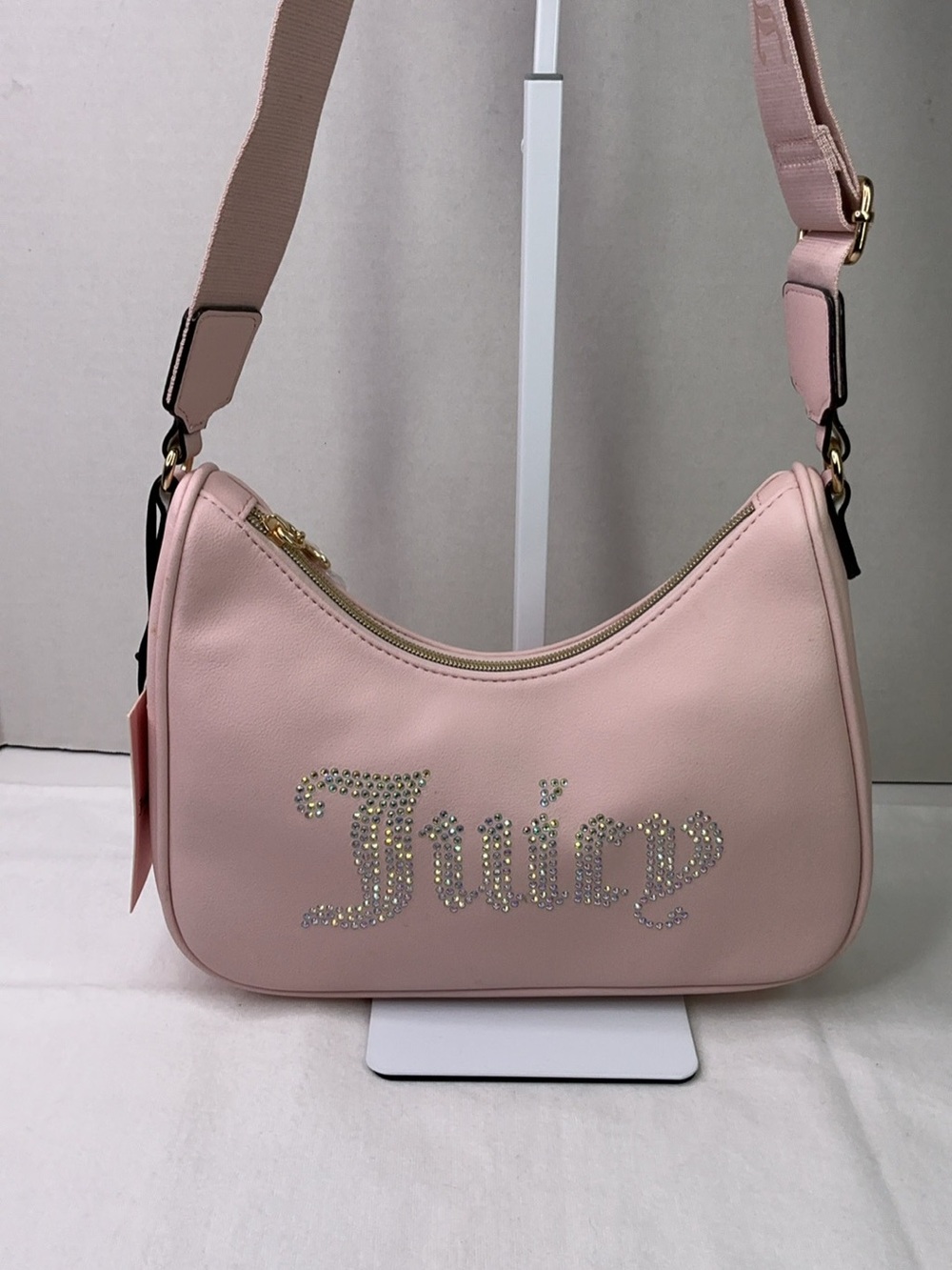 Juicy Couture Pink Clay Obsession crossbody bag.